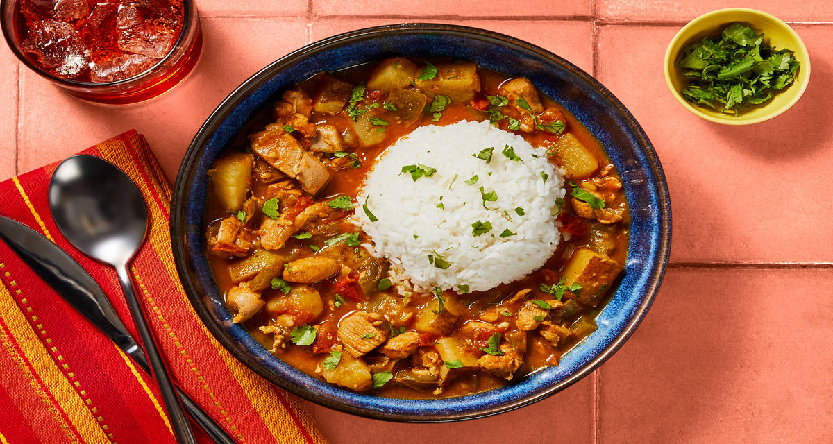 Colombian-Style Chicken Stew Chicken Thighs with Peppers, Potatoes & Rice