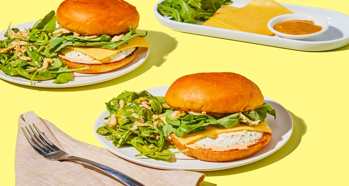 Gouda-Ful Egg & Crispy Onion Sammies with Spicy Crema & Arugula Salad