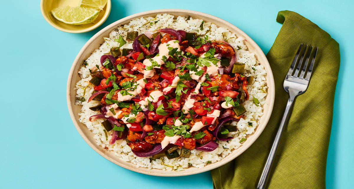 Saucy Chicken Burrito Bowls with Chicken Thighs, Charred Poblano, Smoky Crema & Cilantro Lime Rice