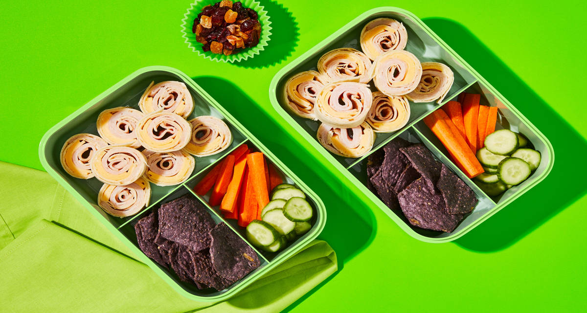 Kid’s Turkey Gouda Pinwheels with Carrot Sticks, Cuke Rounds, Dried Fruit & Tortilla Chips