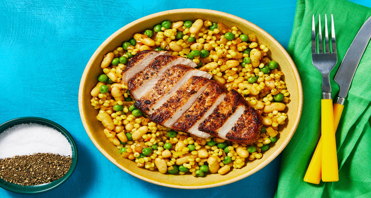 Seared Turkish-Spiced Pork Chops over Couscous with Cannellini Beans & Peas