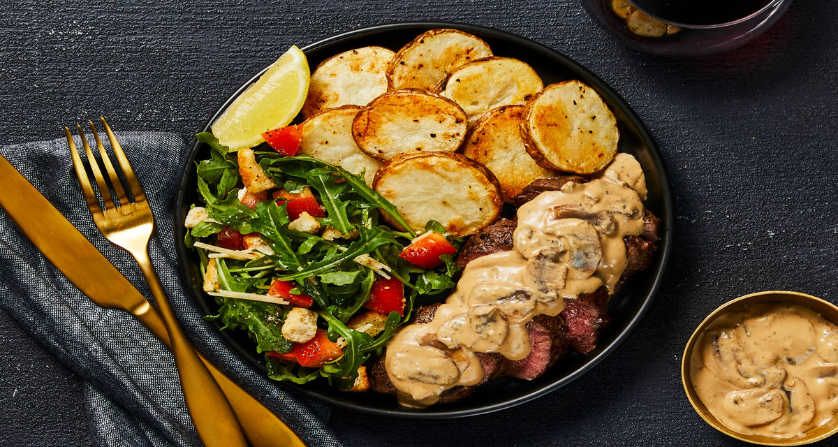 Beef Tenderloin & Creamy Mushroom Sauce with Roasted Potato Rounds & Arugula Parmesan Salad