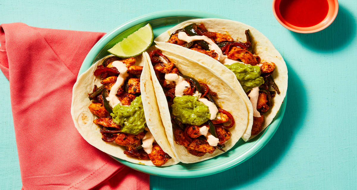 Fuego Chicken Fajita Tacos with Chicken Thighs, Spicy Guacamole & Smoky Red Pepper Crema