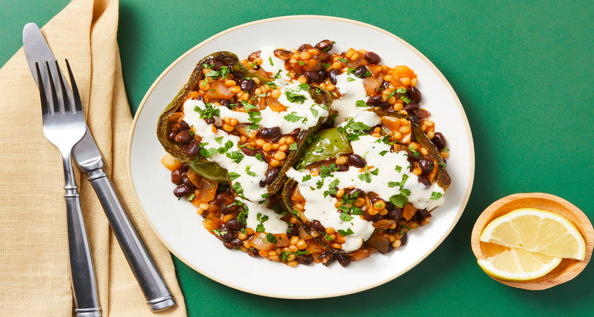 Vegan Southwest Black Bean Stuffed Peppers with Couscous, Lemon Drizzle & Cilantro