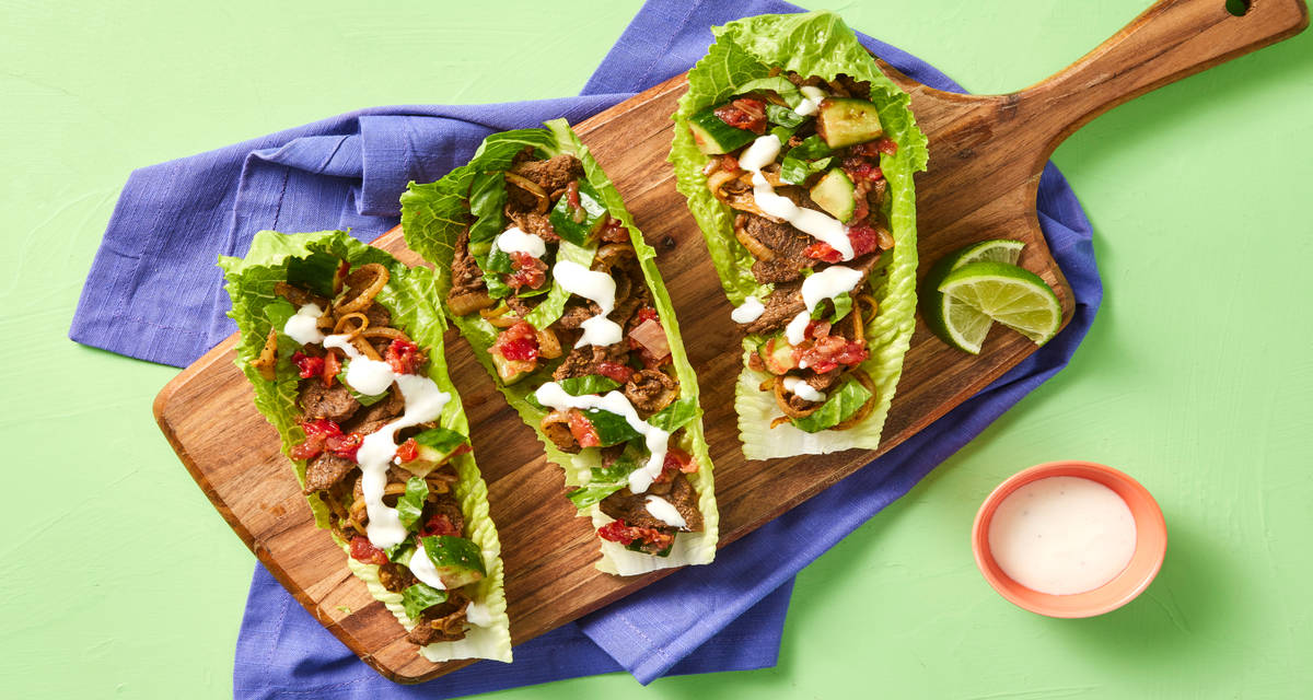 One-Pan Steak & Onion Lettuce Wraps with Cucumber Pico de Gallo & Lime Crema