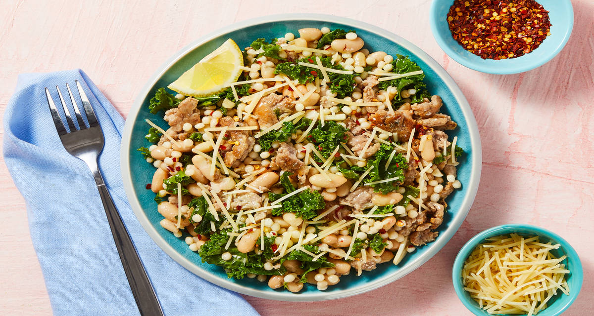 Braised Italian Sausage & White Beans with Kale, Couscous, & Parmesan