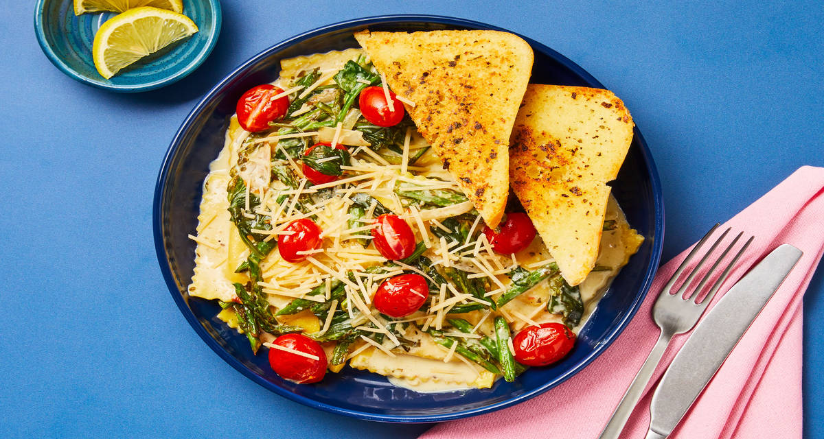 Ricotta Ravioli with Blistered Tomatoes & Asparagus Basil Cream Sauce & Garlic Bread