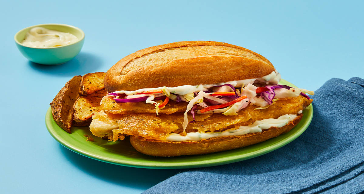 Cajun-Spiced Crispy Tilapia Sandwiches with Potato Wedges, Slaw & Lime Mayo