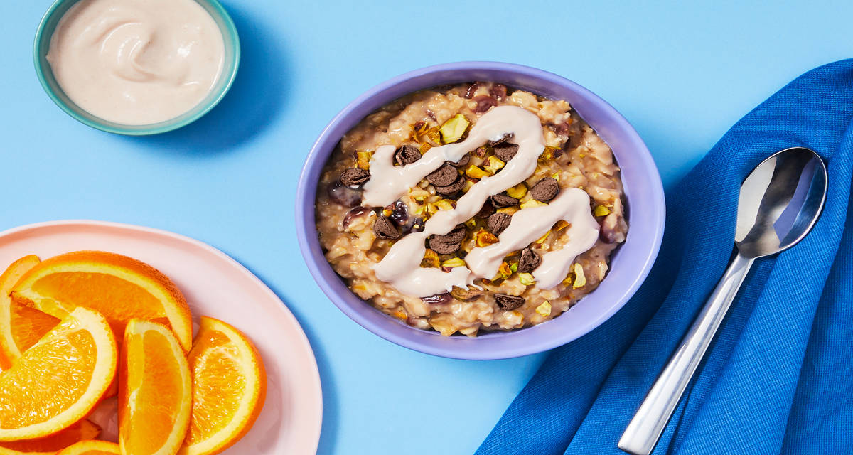 Orange Cranberry Oatmeal with Pistachios, Cherry Drizzle, Chocolate Chips & Orange Wedges