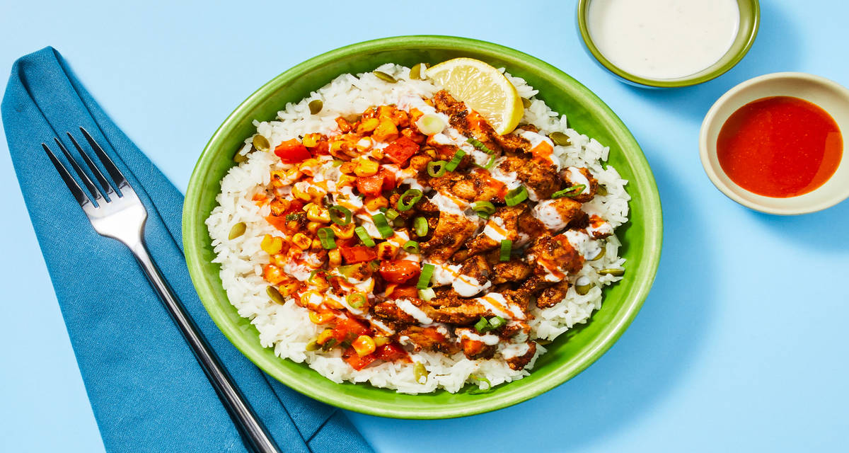 Chicken & Charred Corn Burrito Bowls with Chicken Thighs, Pepita Rice & Lemon Crema