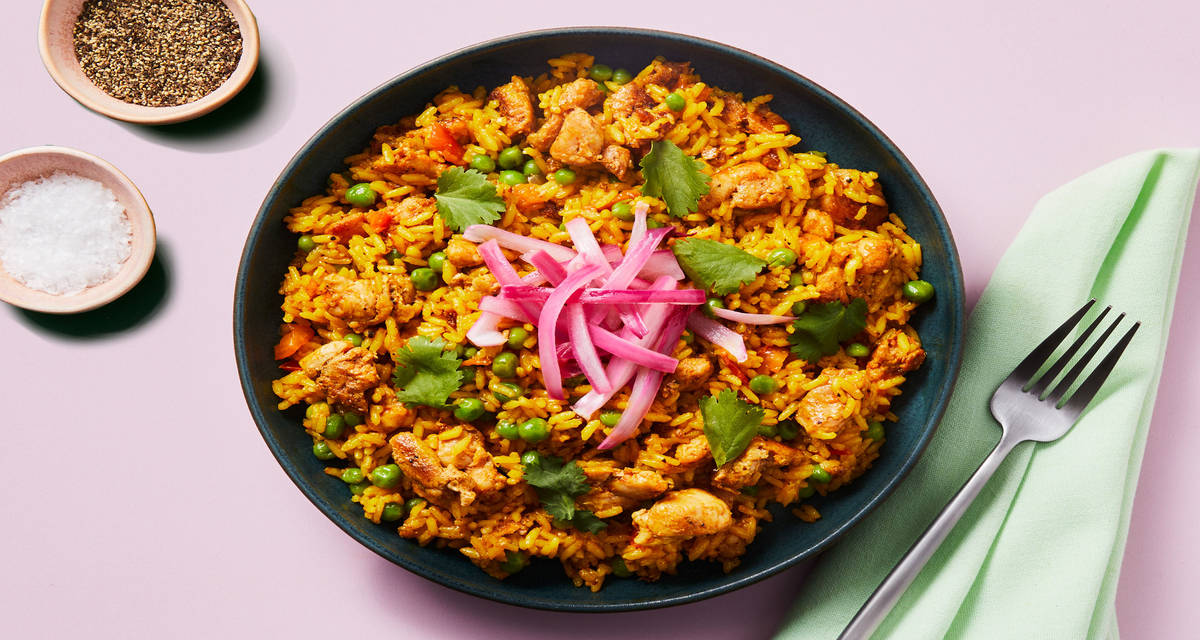 Smoky Chicken Thighs with Yellow Rice plus Peas, Cilantro & Pickled Onion