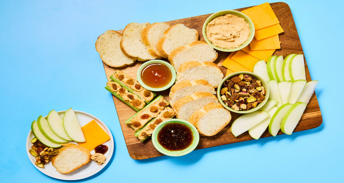 Whipped Peanut Butter & Fruit Snack Board with Cheddar, Ants on a Log, Nut Mix, Fig Jam & Honey