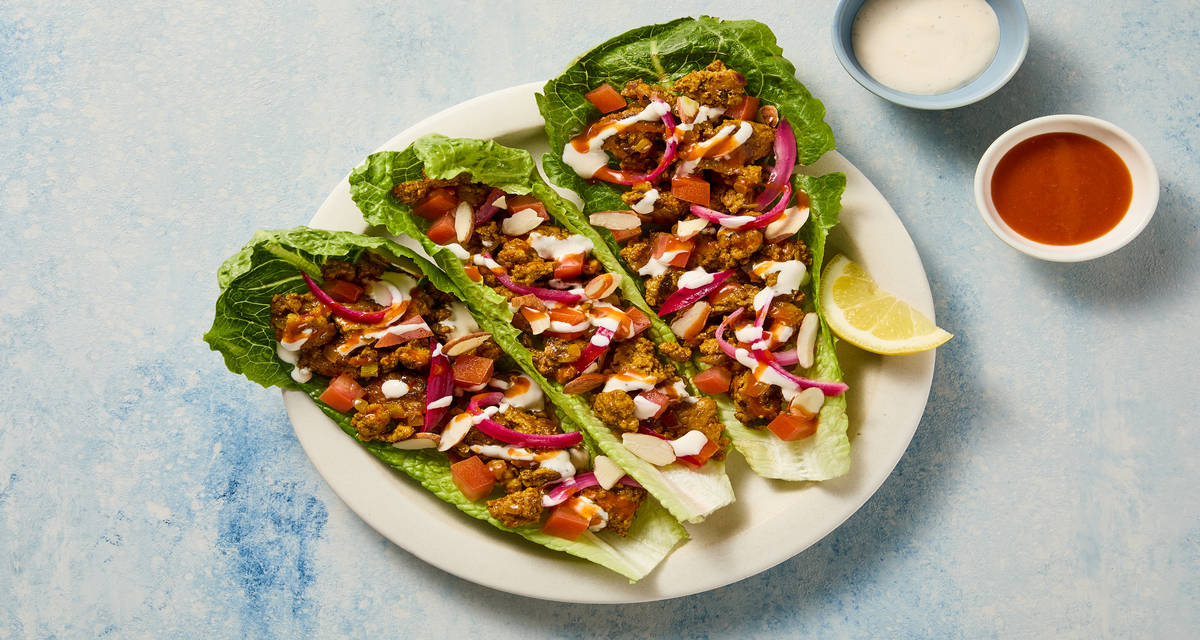 Shawarma-Spiced Turkey Lettuce Wraps with Tomato, Garlicky White Sauce, Almonds & Hot Sauce