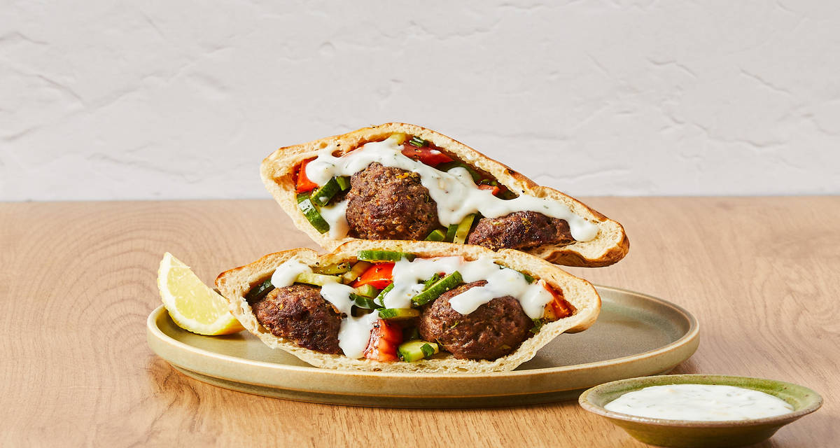 Mediterranean Meatball Pitas with Tomato, Cucumber & Dill-Yogurt Sauce