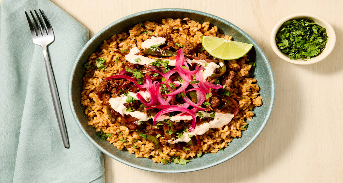 Yucatán Citrus Beef Bowls with Green Pepper, Red Pepper Crema & Pickled Onion