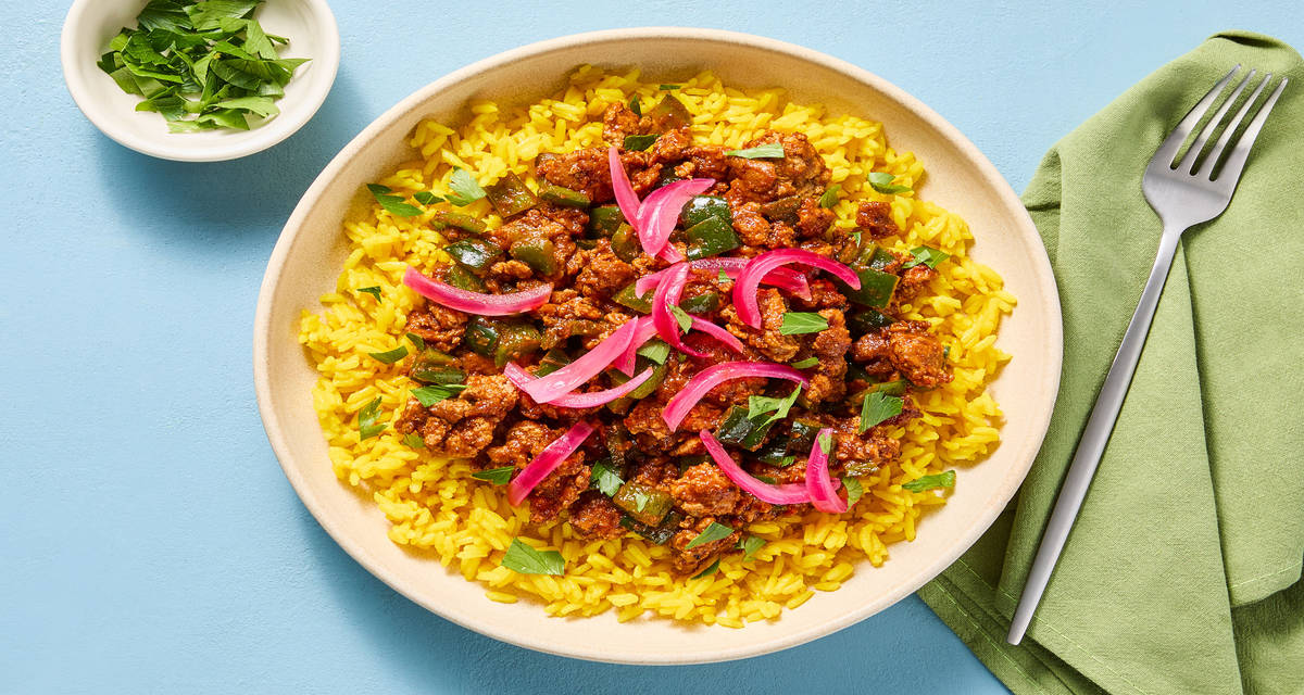 Paprika Turkey & Yellow Rice Bowls with Pickled Red Onion