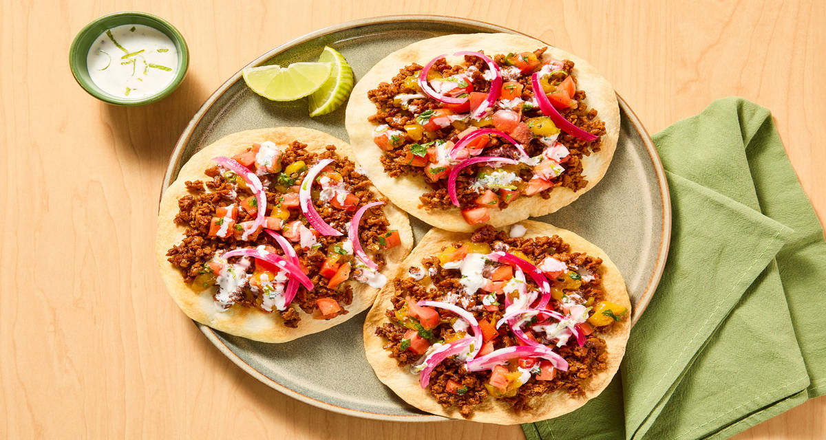 Tex-Mex Plant-Based Protein Tostadas with Pineapple Salsa, Pickled Onion & Cilantro-Lime Drizzle
