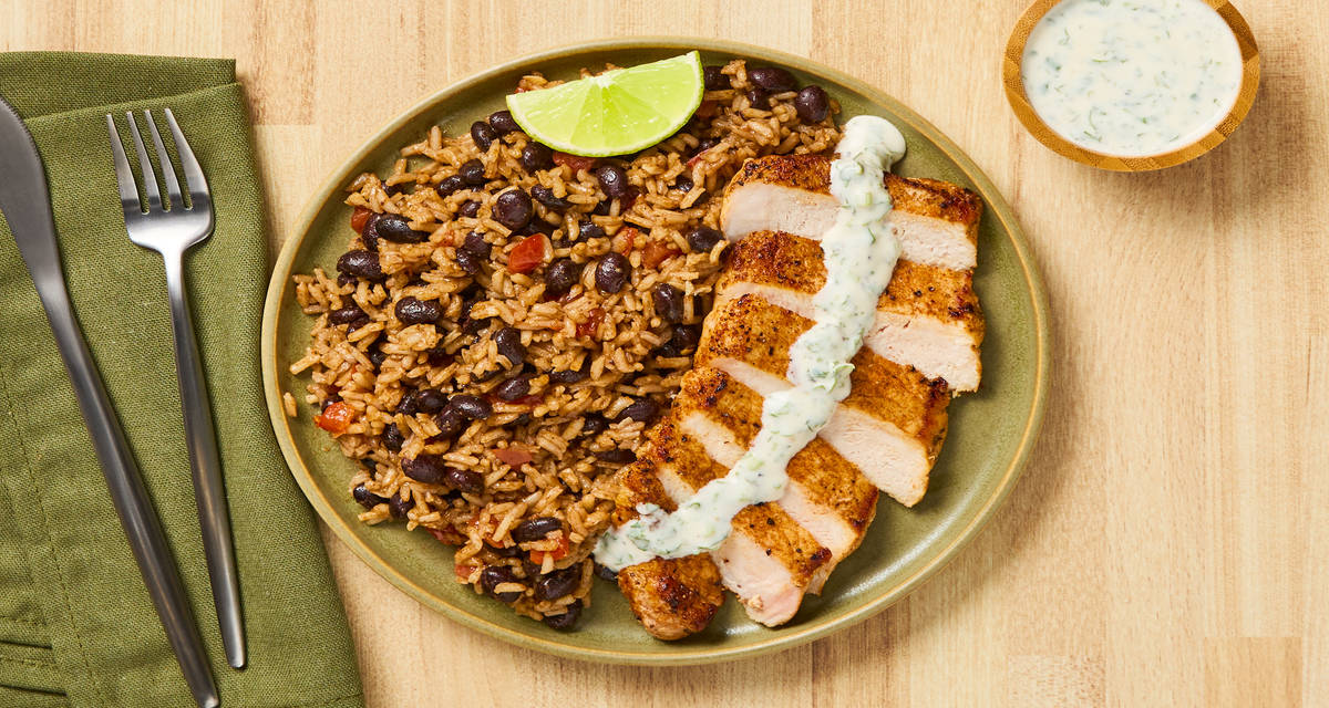 Fajita-Spiced Pork Chops with Rice, Black Beans & Cilantro-Lime Crema