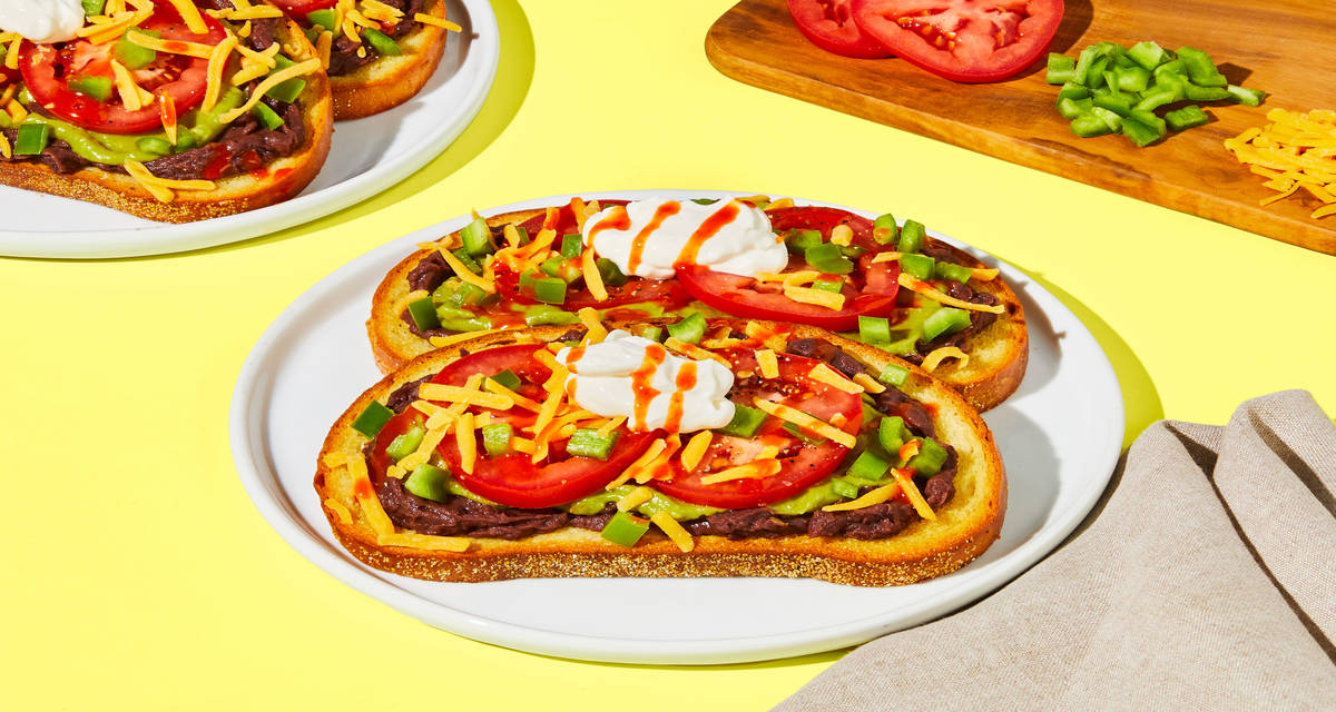 7-Layer Dip Avocado Toasts with Tomato, Refried Black Beans & Cheddar