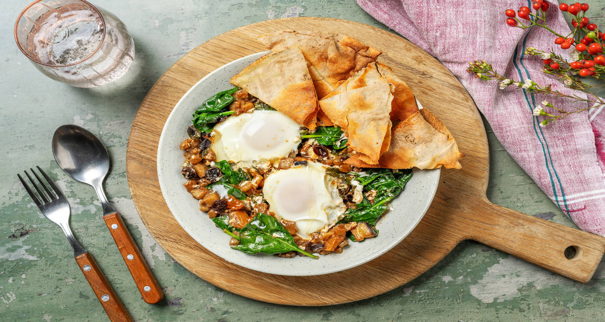 veggie shakshuka met pompoenpitolie en Libanees platbrood