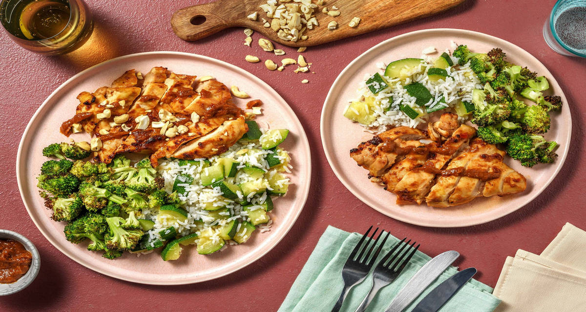 Super Sticky Chicken Thighs with sweet peanut butter, peas rice and zucchini sticks
