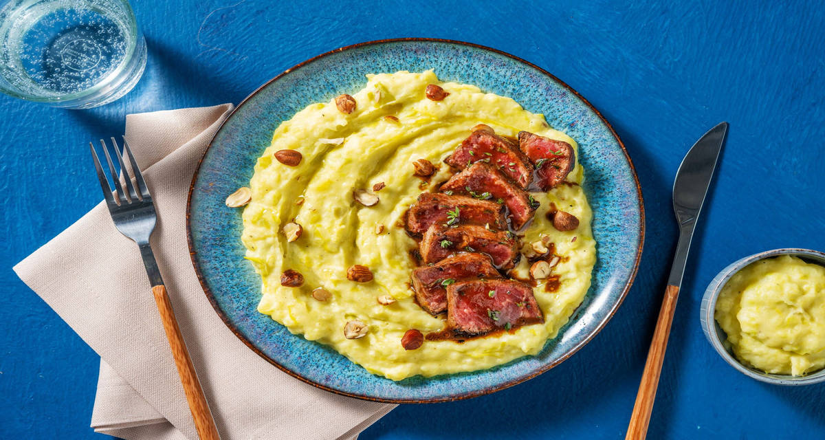 Straccetti di manzo con glassa alle erbe su crema di porri e patate