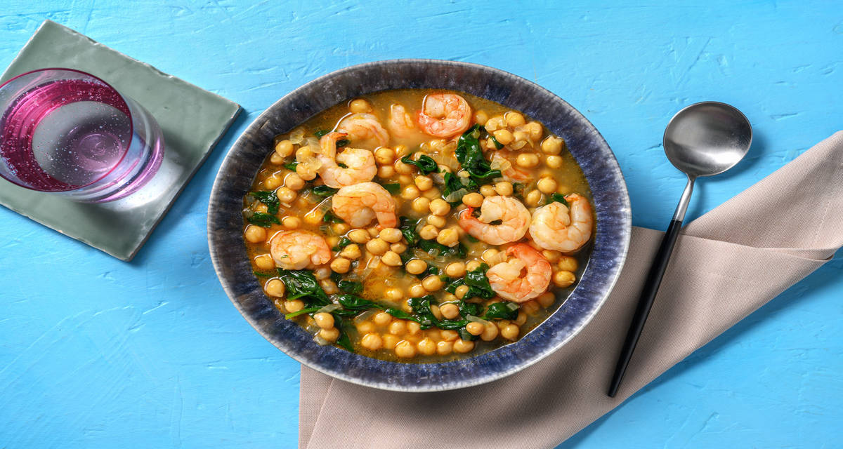 Estofado de garbanzos y gambas al ajillo con brotes de espinacas
