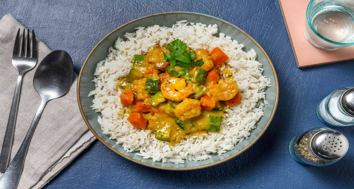 Curry aromatico di gamberetti con riso Basmati, carote e zucchine