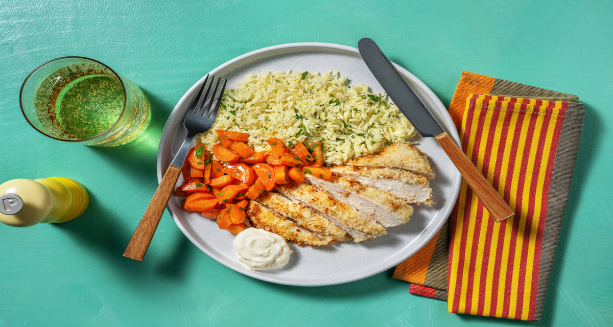 Pollo rebozado con mayonesa cítrica acompañado de zanahoria a la miel y arroz con perejil y limón