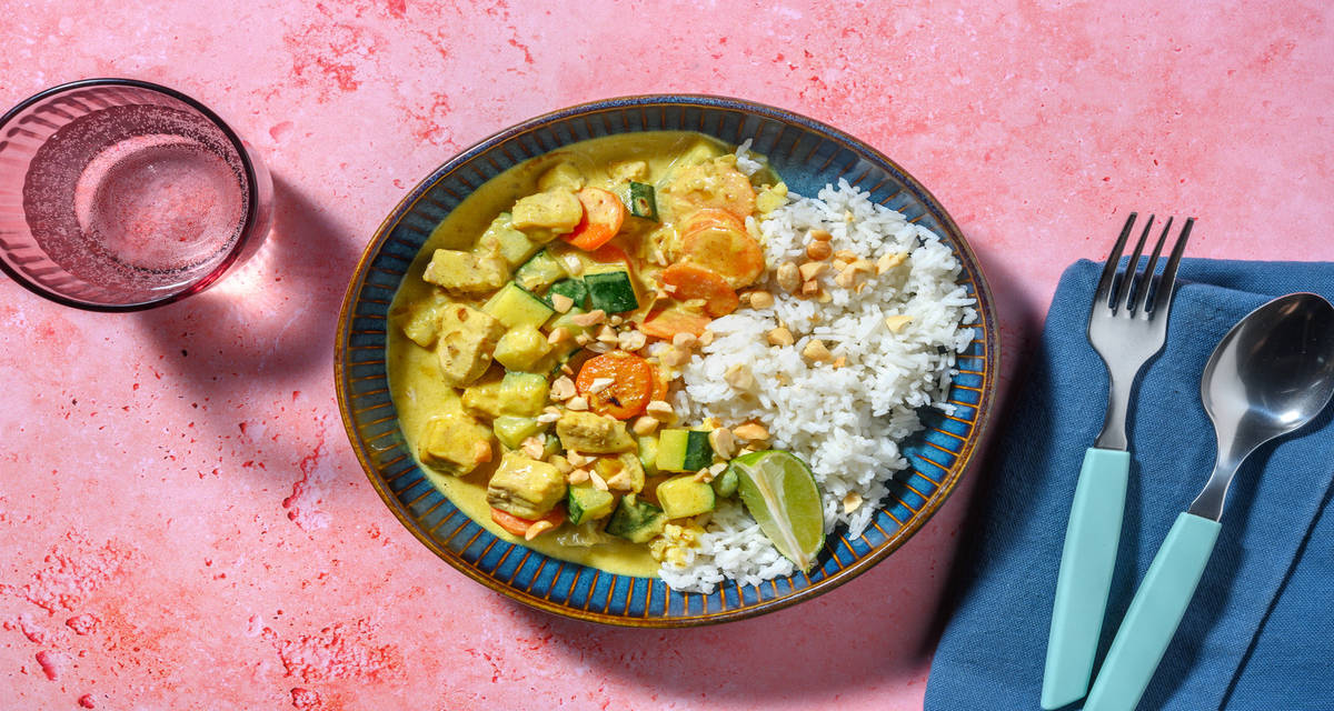 Curry di mazzancolle al curry giallo con latte di cocco, zucchine e arachidi