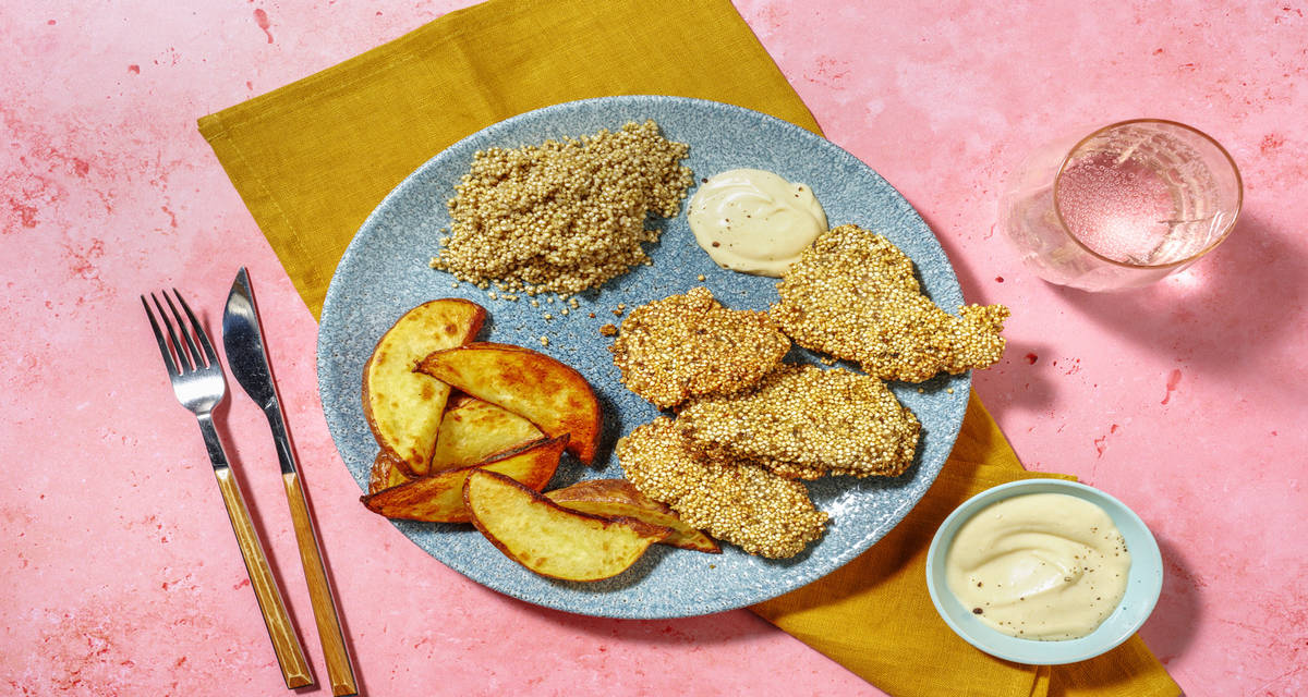 Muslo de pollo rebozado en quinoa crujiente acompañado de patatas al horno y mayonesa de mostaza y miel