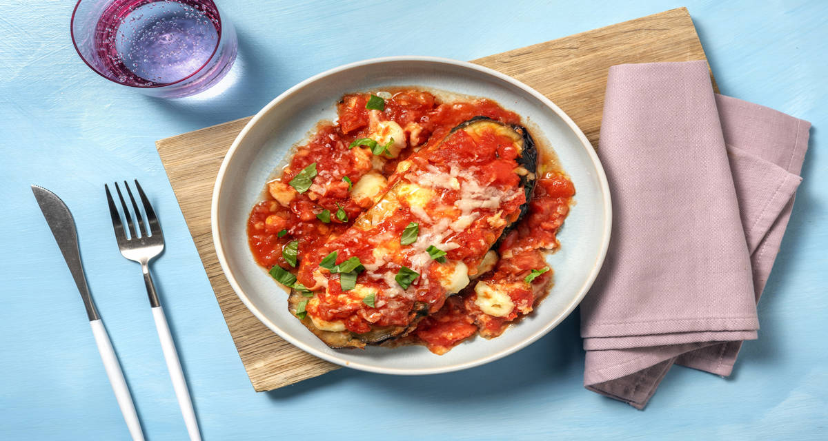 Aubergine Parmigiana with warmed baguette and melted mozzarella