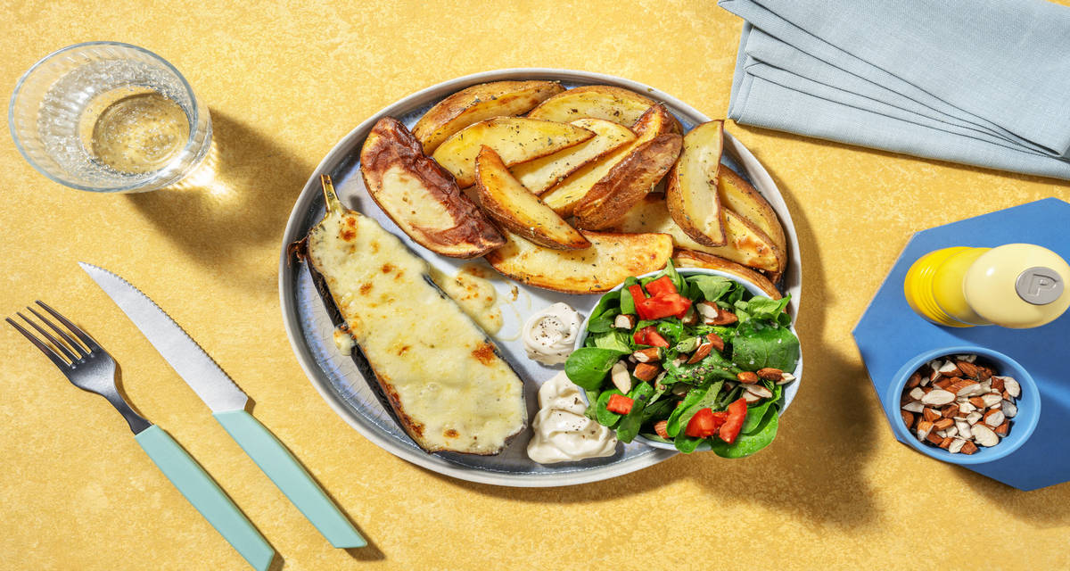 "Bistecca" di melanzane al forno e mozzarella con patate all'origano, songino e cuore di bue