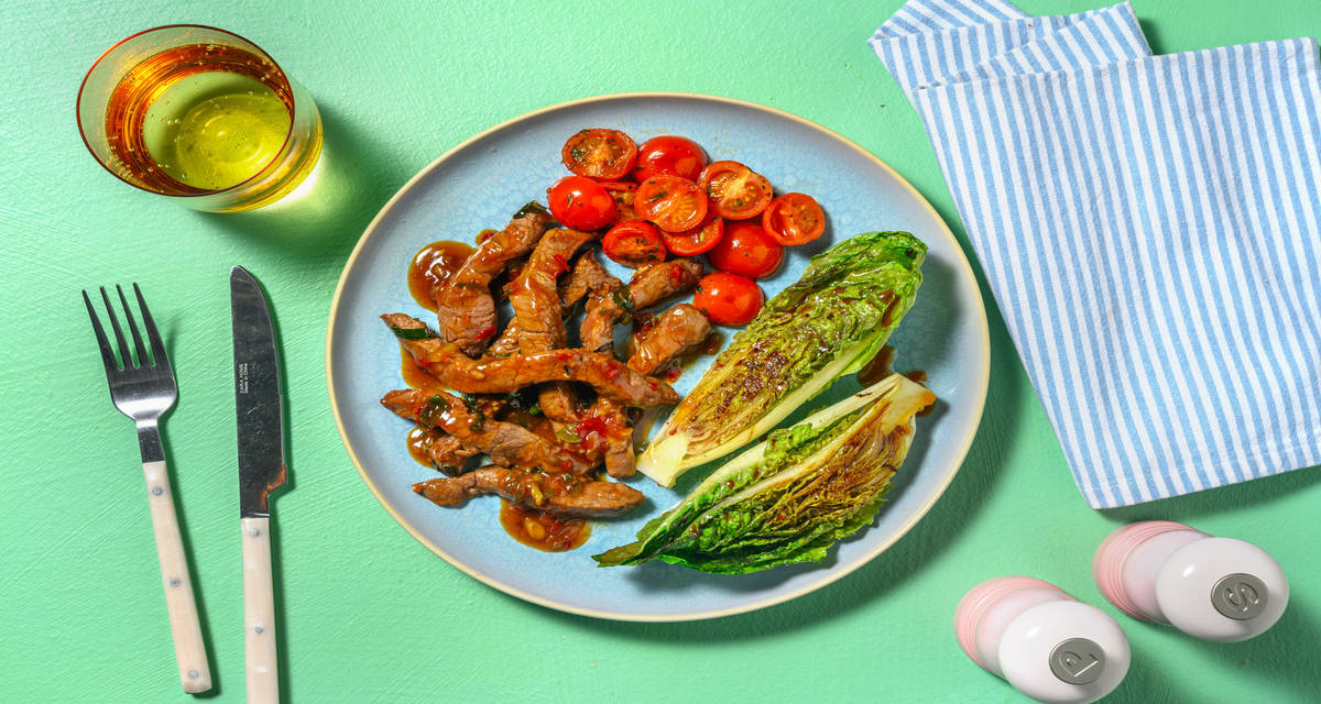 Ternera con salsa de chile dulce cogollos a la plancha con vinagreta de soja y cherrys salteados