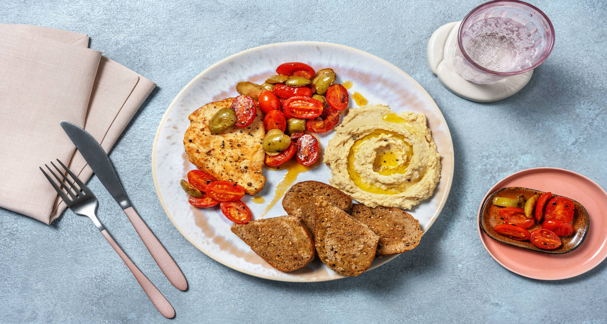 Scaloppine di pollo alle olive e bruschette con melanzane al funghetto mandorle e uvetta