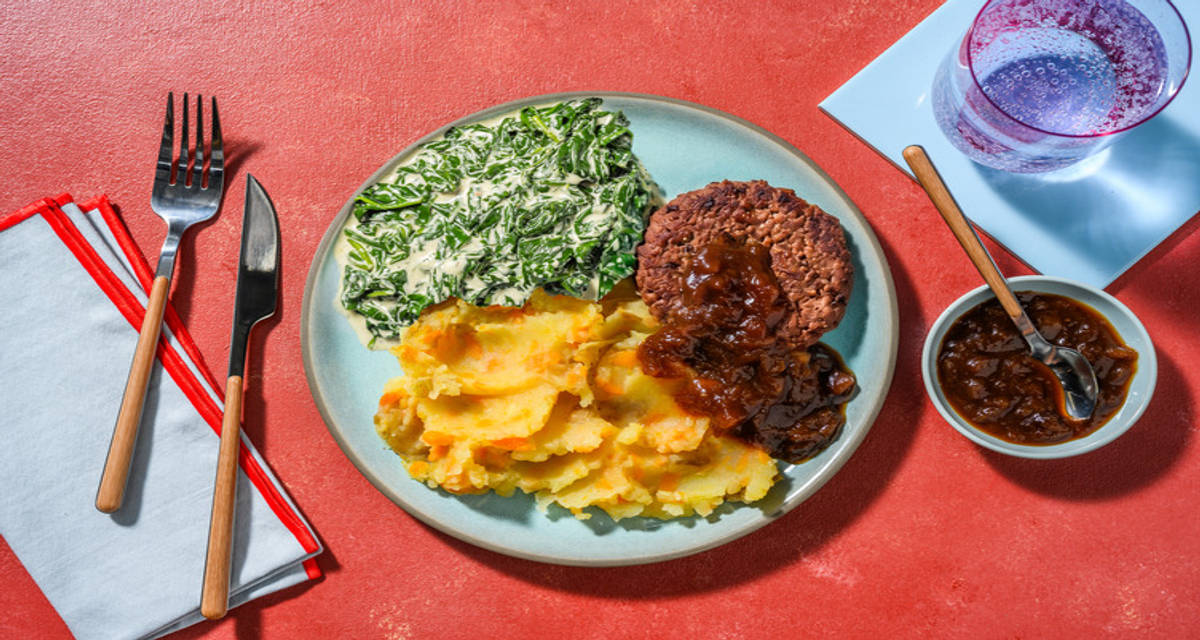 Veggie burger met romige spinazie met wortelpuree en uienchutney