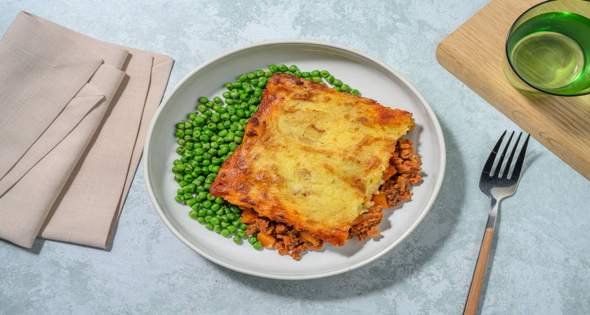 Classic Cottage Pie with vibrant green peas