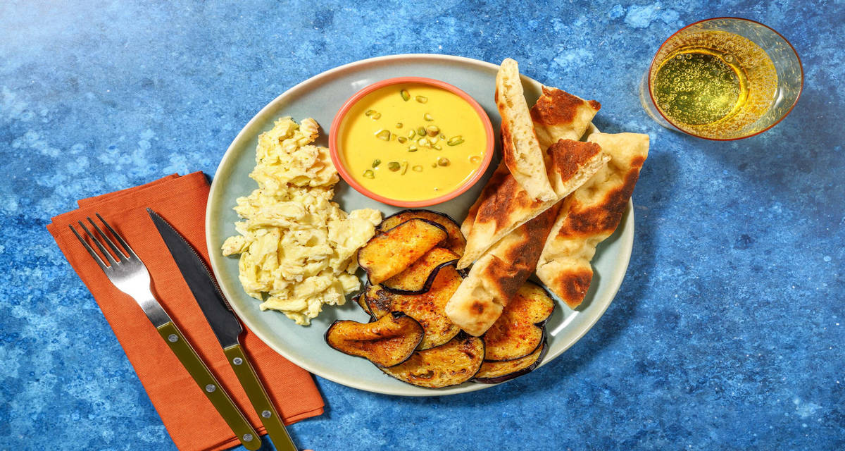 Zighinì di uova e carne all'eritrea con naan, melanzane all'harissa e crema di carote