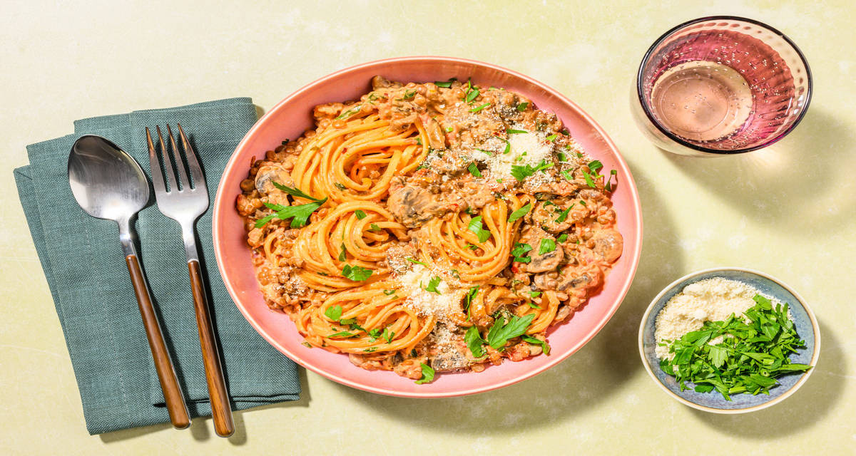 Lentil Ragu Linguine with mushrooms and parsley garnish