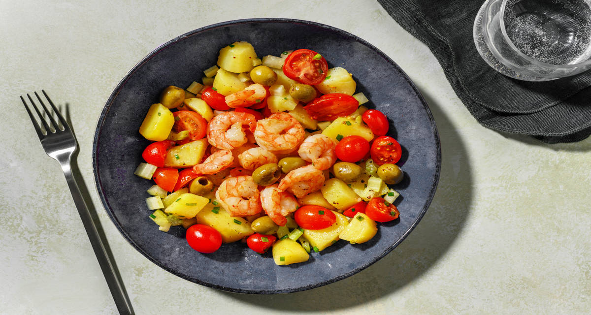Insalata tiepida alle mazzancolle e pomodorini con olive, patate e citronette al limone