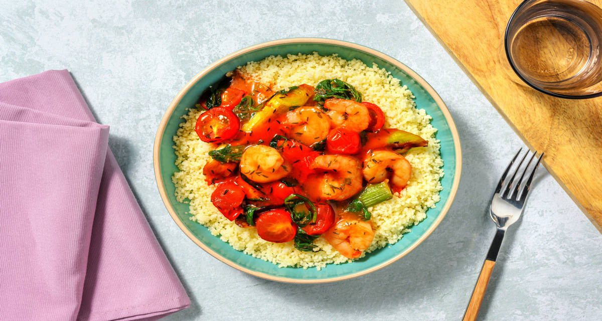 Salteado de langostinos con puerro y cherrys servido sobre cuscús