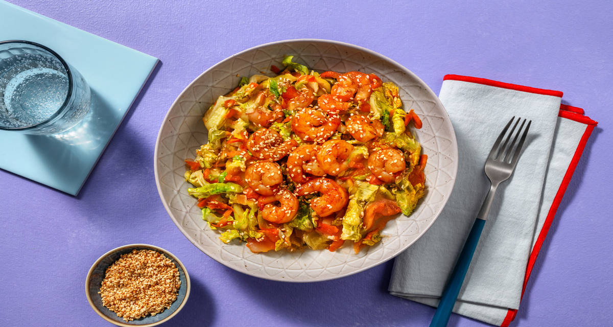 Langostinos con miel y soja sobre ensalada aderezada con vinagreta de sésamo