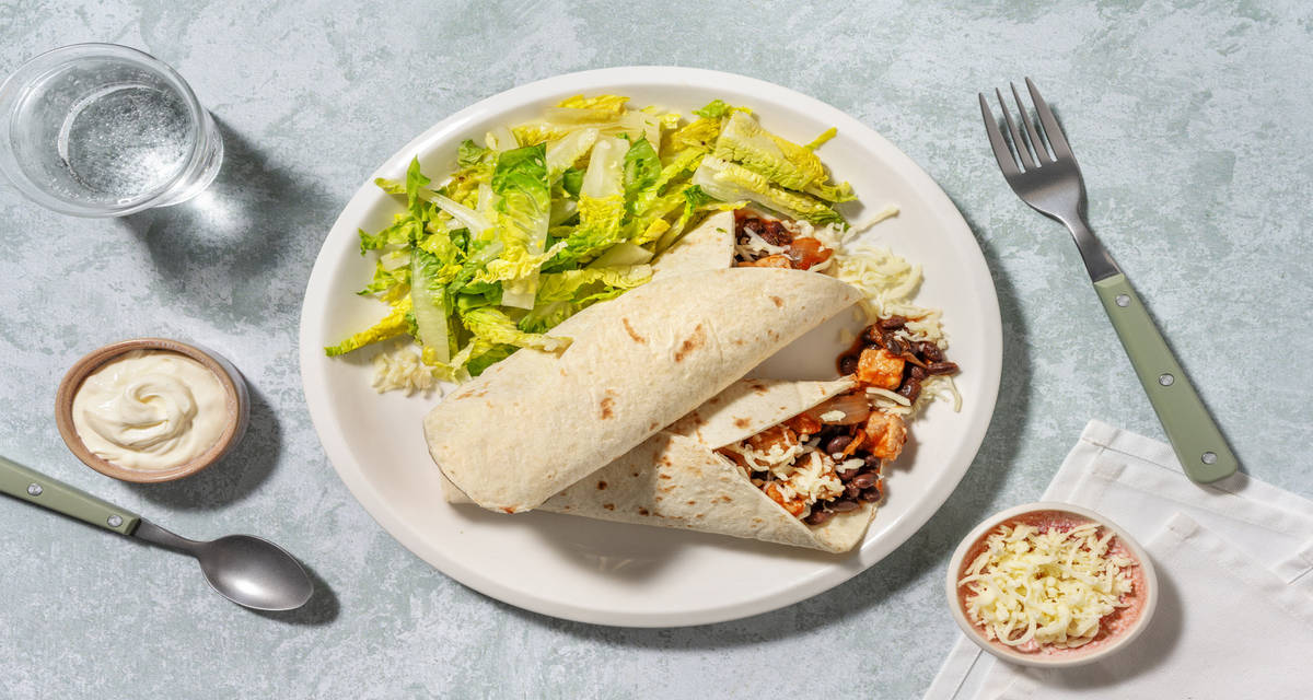 Burrito au porc mariné à la mexicaine avec des haricots noirs & du cheddar