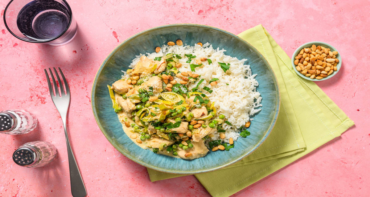 Creamy Chicken and Leeks with rice and parsley garnish