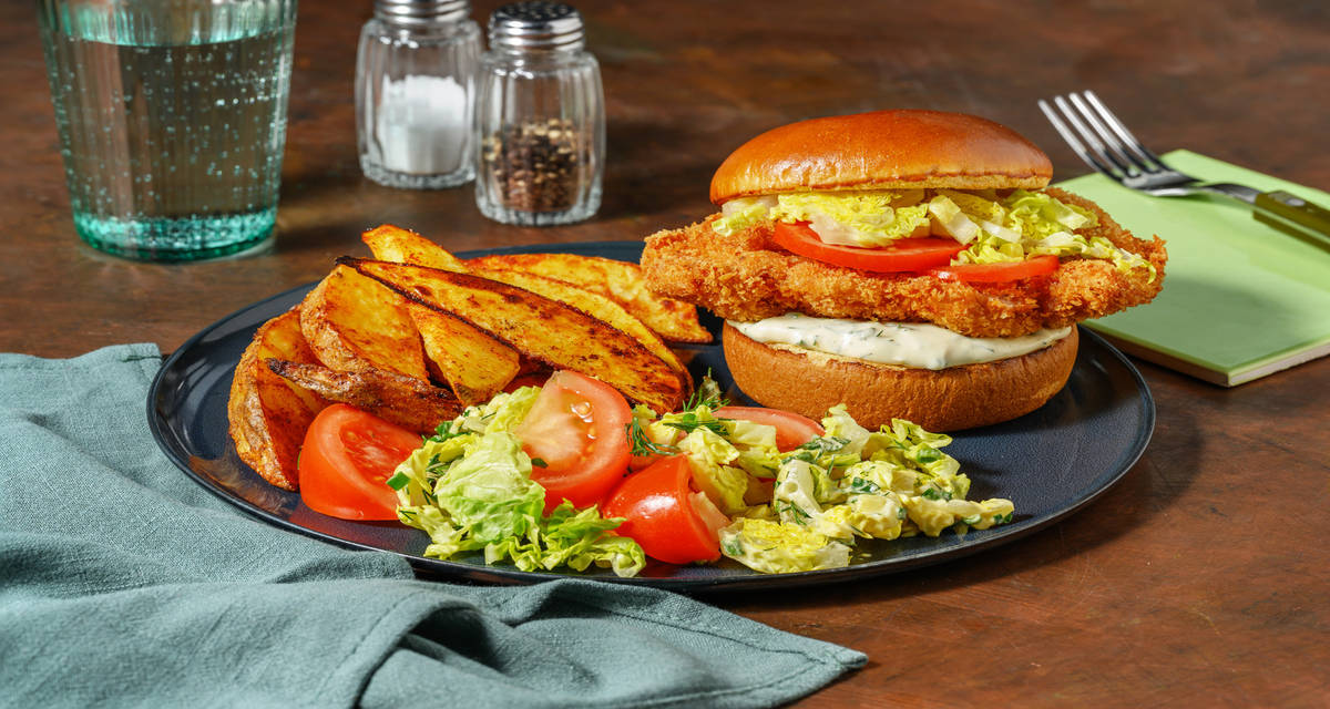 Le Saloon Burger au poulet pané avec une mayo herbacée & des smoky potatoes