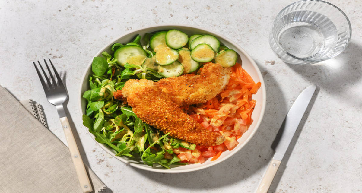 Bol de pollo rebozado al estilo provenzal con verduritas aderezadas con vinagreta de mostaza y miel