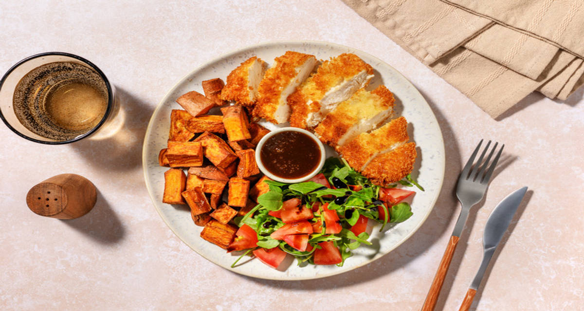 Crumbed Beef Rump and Sweet Potato Chunks with tomato side salad
