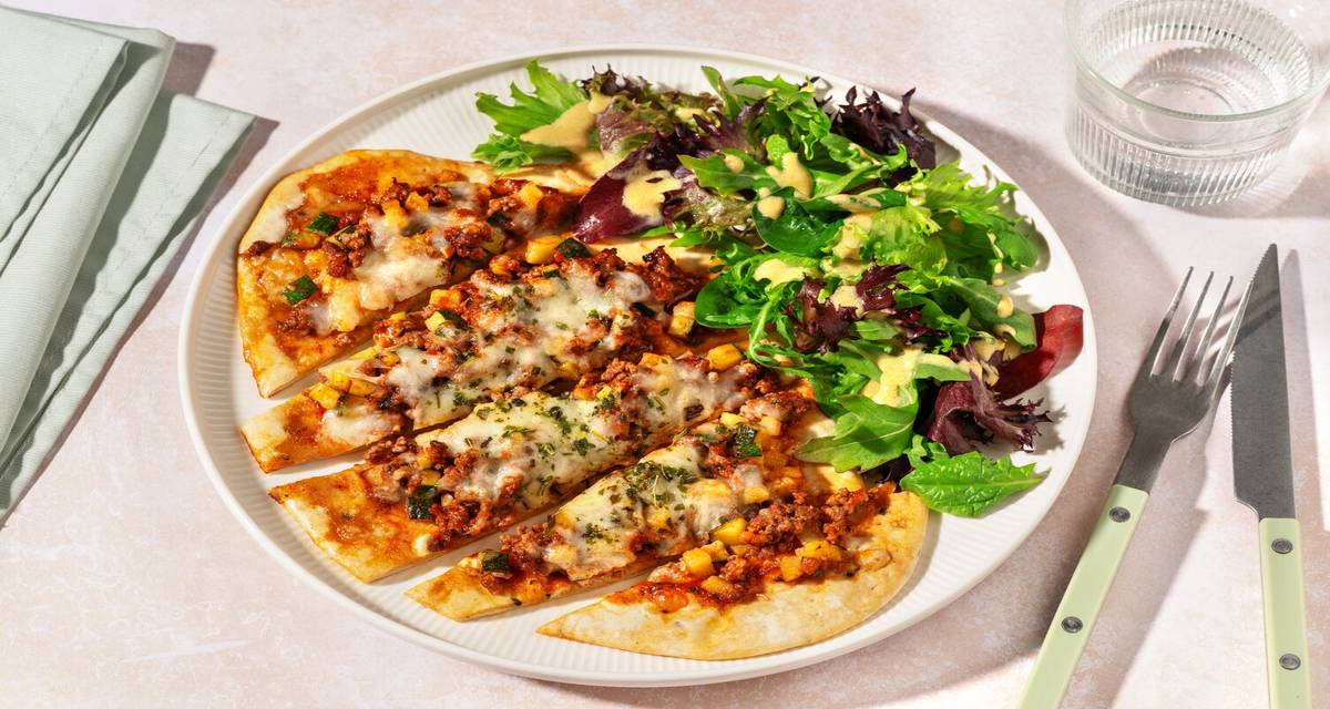 Pizza naan Campione : bœuf haché & gouda garnie d'épices à l'italienne & courgette