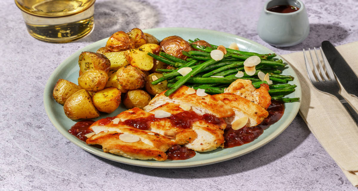 Chicken and Rosemary Roast Potatoes with cranberry chutney and green beans
