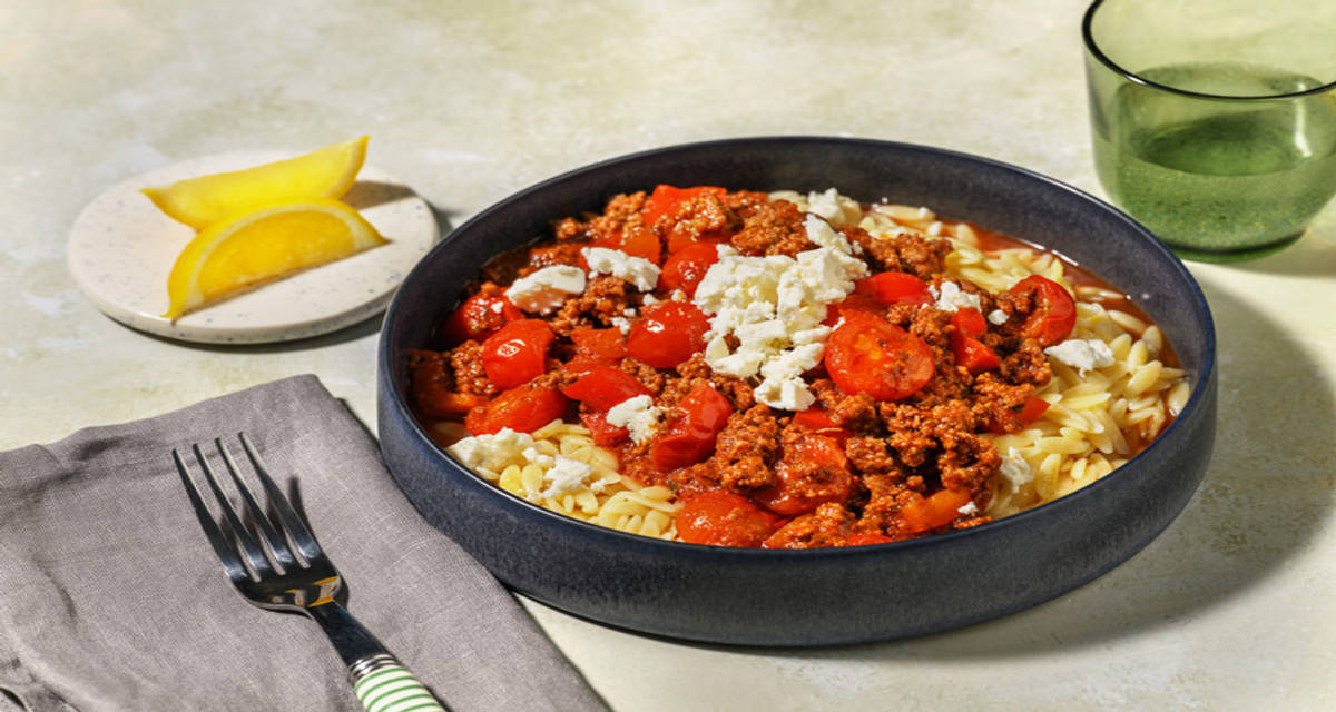 Lemony Turkey and Orzo Bowls with bell pepper and cherry tomatoes